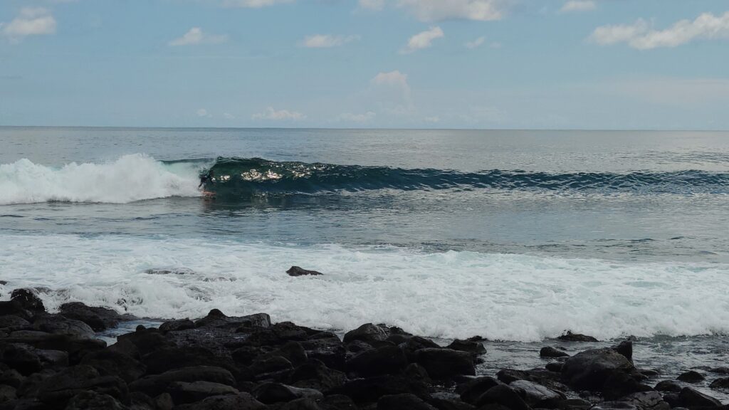 surfing a tube at La Loberia San Cristobal Galapagos