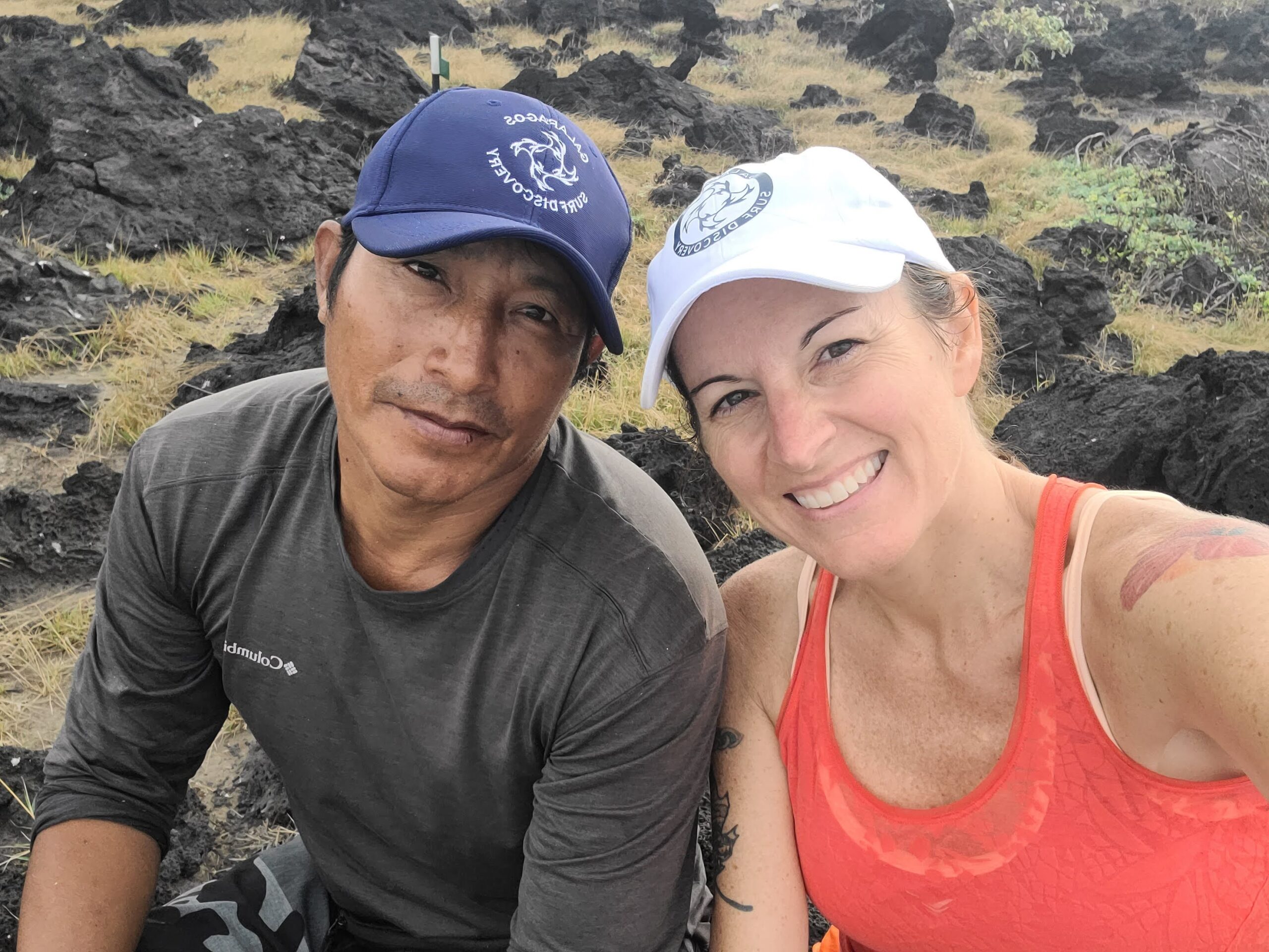 man and woman wearing galapagos surf discovery hats