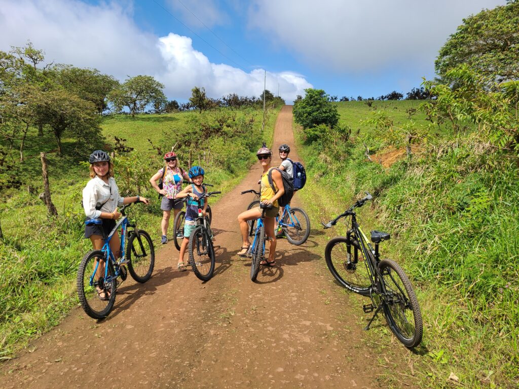 group of people on bicycles in san cristobal galapagos highlands