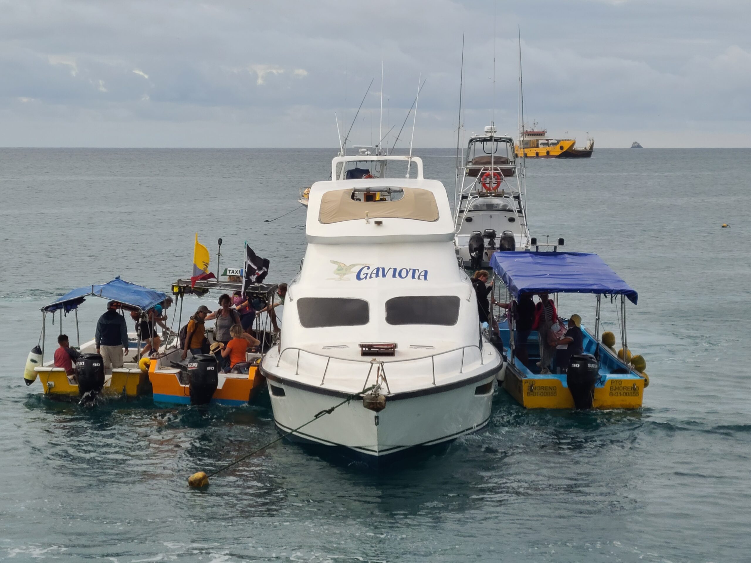 transferring to water taxis from an inter-island ferry, San Cristobal, Galapagos