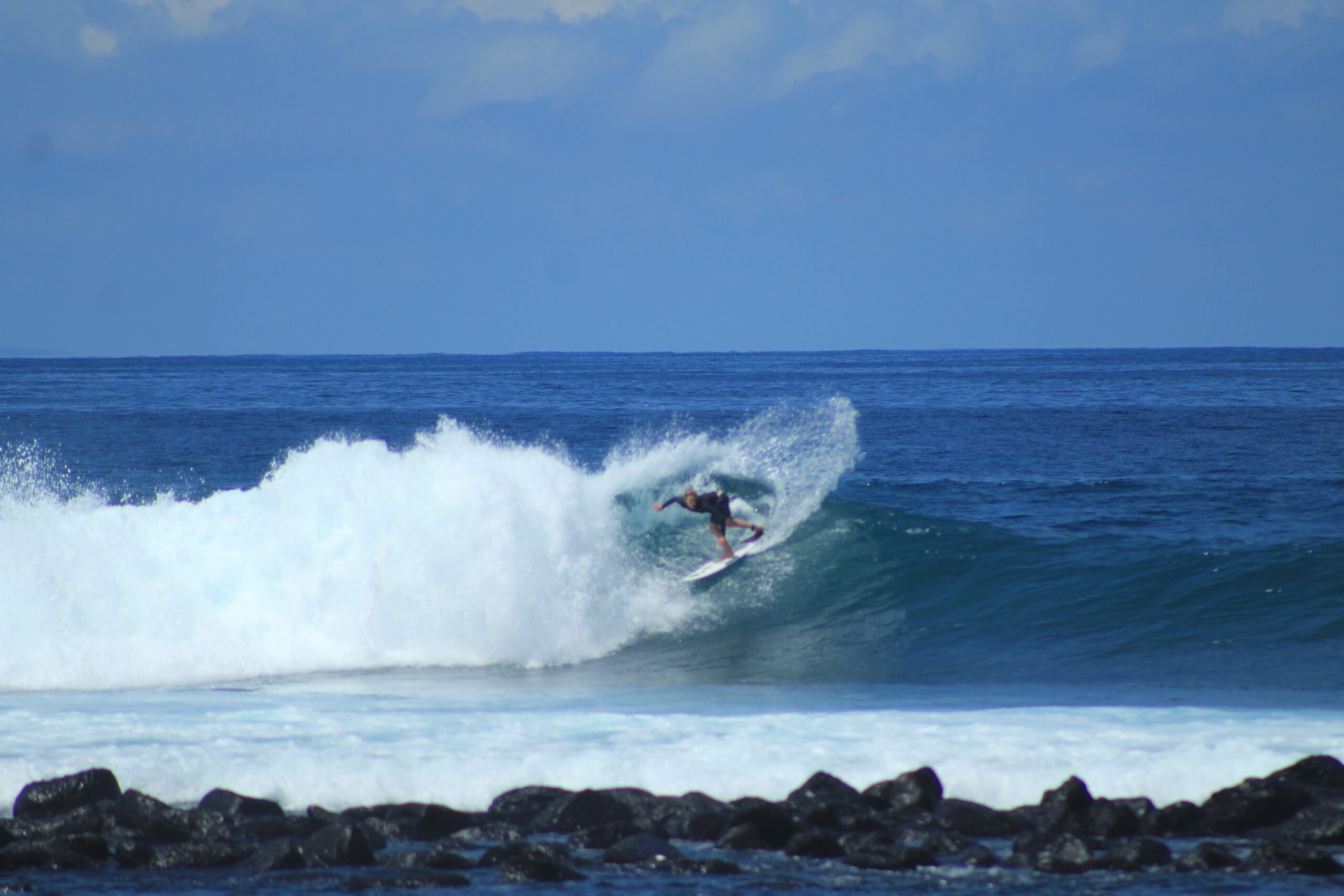 WSL competitor surfing at La Lobería, San Cristobal, Galapagos