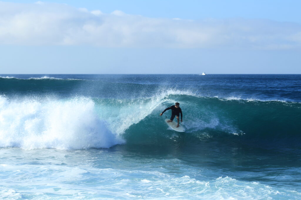 Marino surfing El Canon, San Cristobal, Galapagos