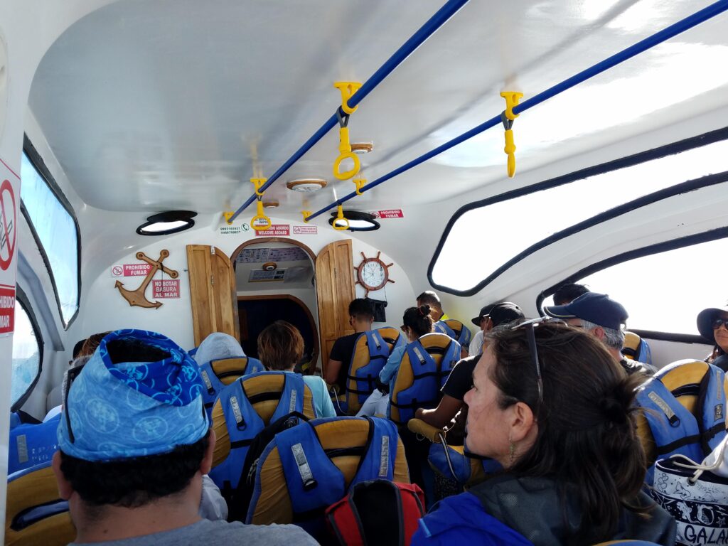 passengers wearing life jackets on interisland ferry galapagos