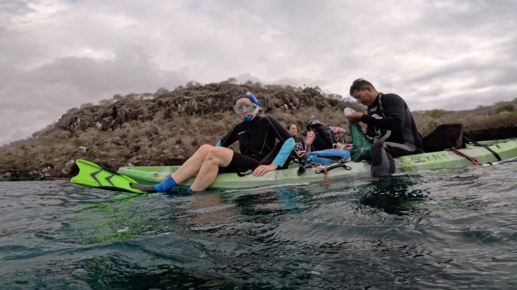 preparing to snorkel from kayaks in Darwin Bay, San Cristobal, Galapagos