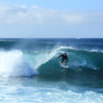 Marino surfing El Canon, San Cristobal, Galapagos